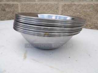 Stacked set of 0.50 Qt. stainless steel mixing bowls, each 6 inches round, in good condition.