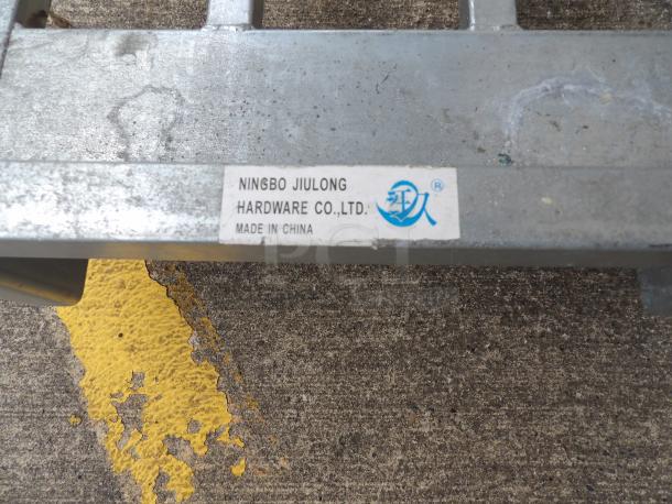 18" x 52" chrome utility cart, two shelves, heavy-duty. Label shows Ningbo Jiulong Hardware Co., Ltd., made in China.