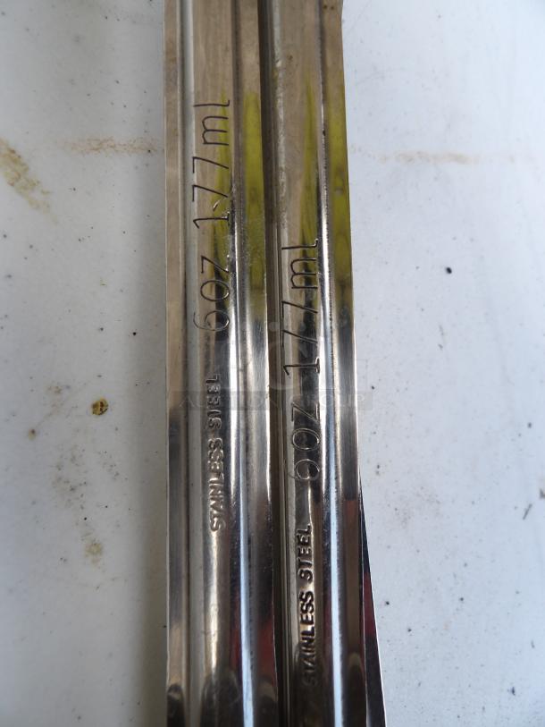 Stainless steel 6 oz ladles set, marked "6 oz / 177 ml" and "Stainless Steel," in good condition.