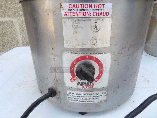 APW Wyott food warmer with dial control, stainless steel, labels warn "Caution Hot." Powers on and heats efficiently.