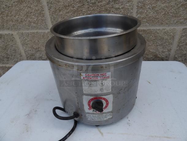 APW Wyott food warmer, stainless steel, working condition, with temperature dial and caution label visible.