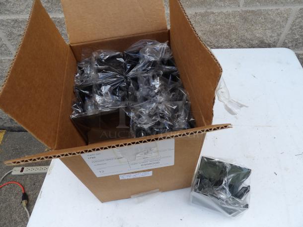 Box of brand new Smucker Caddies, 11 pieces, wrapped in plastic. Box label shows part and serial numbers.
