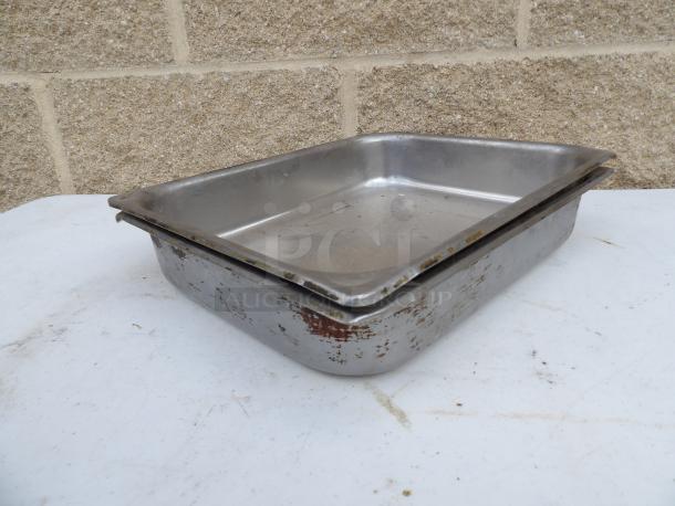 1/2 Size 2" Deep Anti-Jam Stainless Steel Steam Table Pan, 24 Gauge. Shows signs of use. Durable for catering needs.
