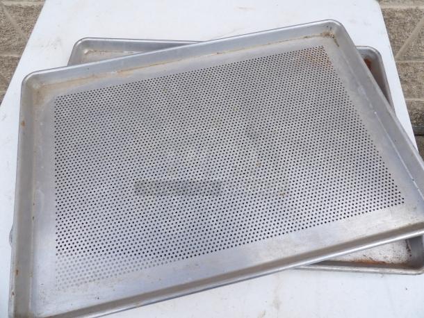 Full Size 19 Gauge 18" x 26" perforated aluminum sheet pan, wire-in-rim, used condition.