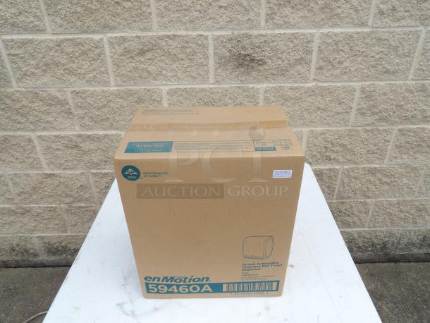 New in box enMotion 59462A automated touchless paper towel dispenser, grey, 14.7"x9.5"x17.3", labeled GP PRO.