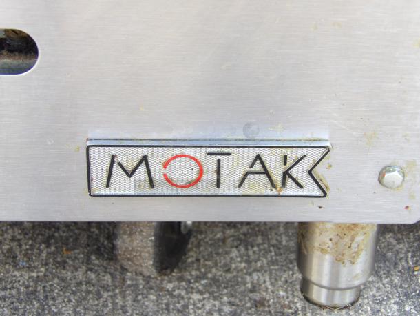 MoTak MGR36-T 36" gas griddle in like new condition, features 3/4" steel plate and thermostatic controls, logo visible.