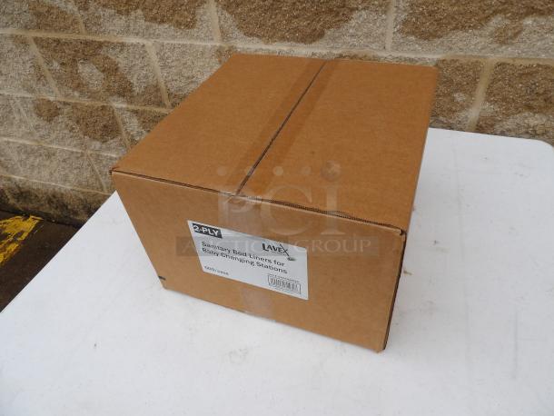Lavex 2-Ply Baby Changing Table Liners, 500 count case. Sealed cardboard box with label indicating item details.