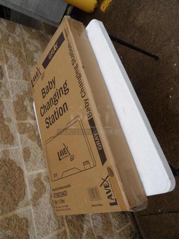 Lavex Gray Horizontal Wall-Mounted Baby Changing Station, Model 47JBCJHGY, in original packaging, 36x21x5 inches.