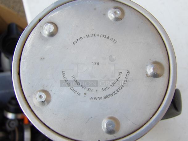 Service Ideas 33.8 oz stainless steel coffee carafe base showing capacity, model 83710, and care info. Black lid included.