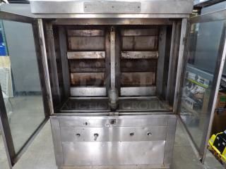 Late Model Rotisserie Gas Model 1545, 120 Volts, stainless steel, 42x21.5x57.5, visible wear, dual doors open, control panel below.