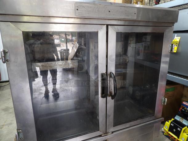 Late Model Rotisserie Gas Model 1545, 42"x21.5"x57.5", stainless steel, dual glass doors, 120 volts, used condition.