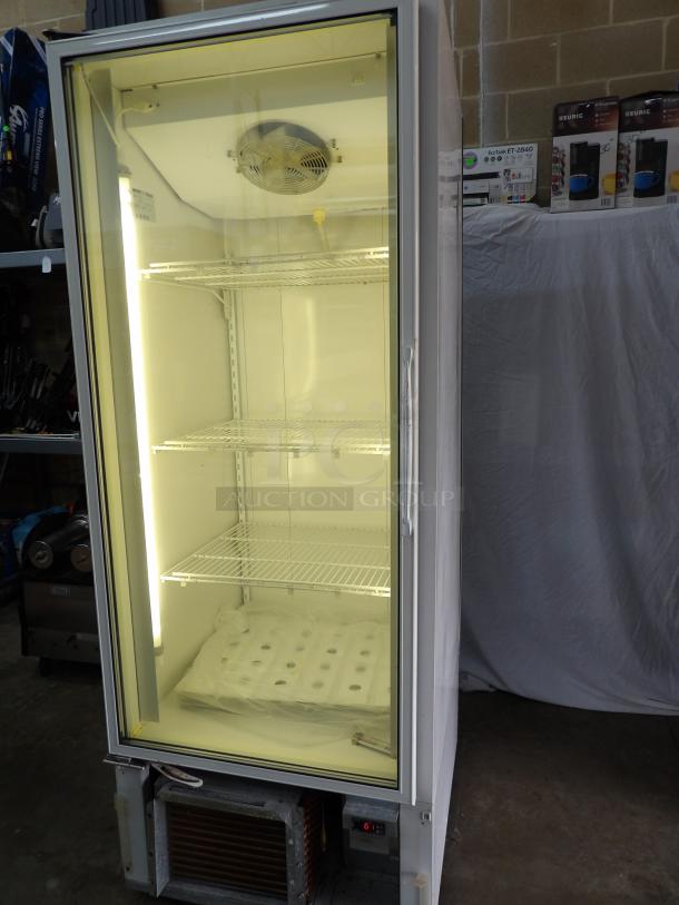 Standex BLG-27HD single glass reach-in freezer with poly coated racks. Powers on, not cooling. 115/220V, 1 phase.