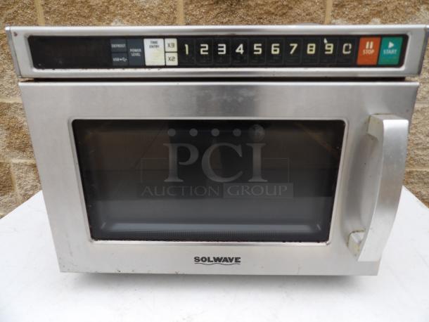 SolWave stainless steel microwave oven, model 180MWHD18. Features include digital controls and power level settings. Used condition.