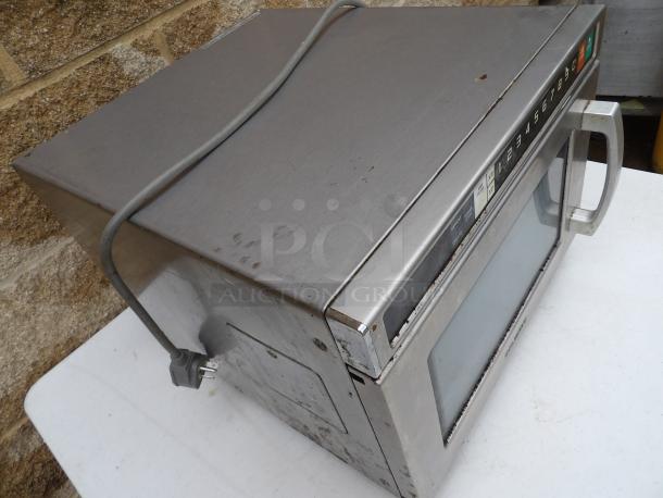 SolWave stainless steel microwave oven, Model 180MWHD18. Features numeric keypad, 208V-230V, used condition.