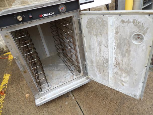 Cres Cor Warmer Model H33912188CS, 120 Volts, open door, visible shelves, stainless steel, working condition, shows wear.