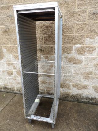 CresCor tray cart on castors, metal construction, vertical tray slots, used condition, no visible tags or markings.
