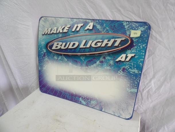 Bud Light tin sign, 30x24 inches, features blue and white graphics with "MAKE IT A BUD LIGHT AT." Good condition.