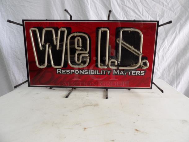 WE ID neon light sign, Budweiser branding, reads "Responsibility Matters," powers on with flickering, visible wear.