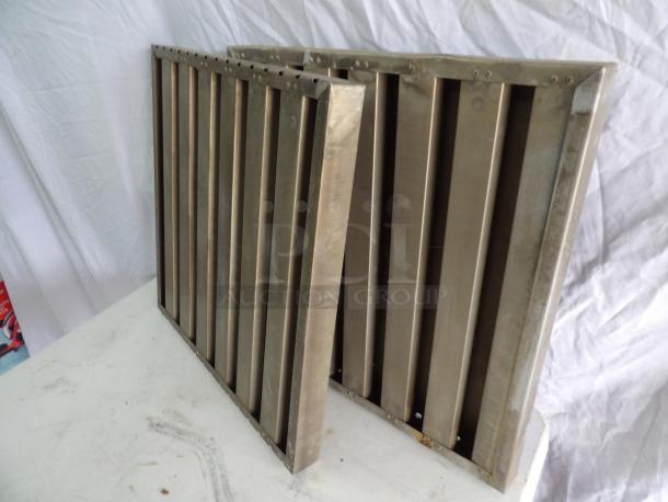 Aluminum grease filters, 19.5x20x1.5 inches, used condition, vertical slats, suitable for kitchen ventilation systems.