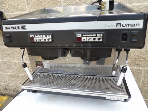 UNIC Model TW Rumba stainless steel commercial 2 group espresso machine with 2 steam wands, 220V, 1 phase.