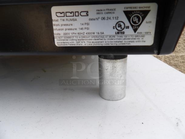 UNIC TW Rumba espresso machine label showing model, pressure specs, 220V, 1 phase, 4300W, UL listed, made in France.