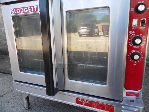 Blodgett Mark V stainless steel convection oven, electric-powered, on legs. Features dual glass doors and control panel.