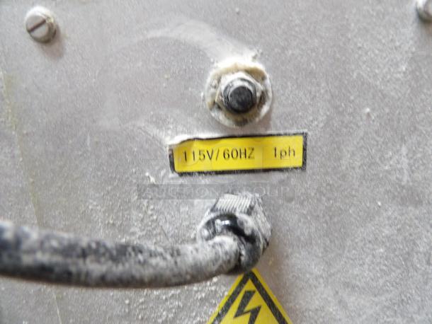 Thunderbird ARM-30N mixer label showing 115V, 60Hz, 1 phase. Dusty metal surface with visible wiring.