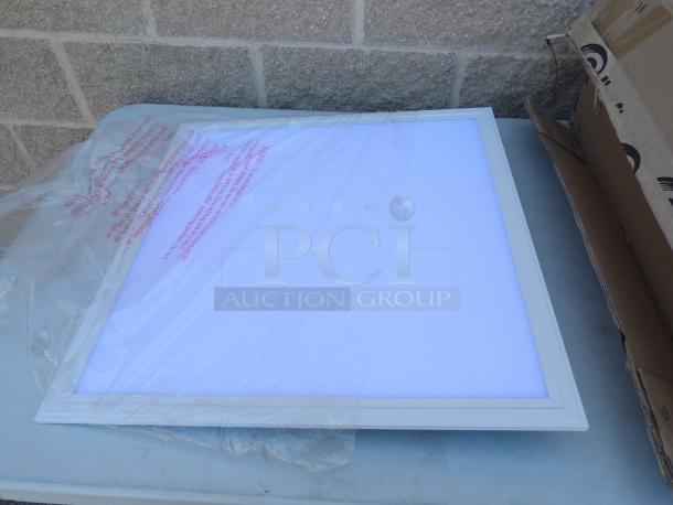 Ultra-thin Panel Light by James Industry, model ZY-P4-40W-CDS, in original packaging, ideal for replacing 2x2 fluorescent troffers.