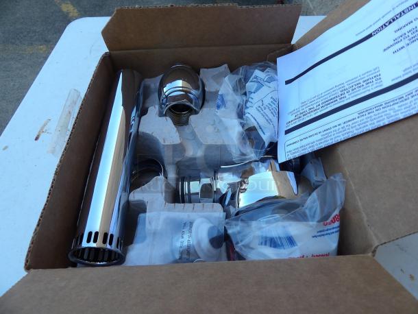 New in box Sloan 111XL manual top spud flush valve, 1.6 gpf, chrome, with installation guide.