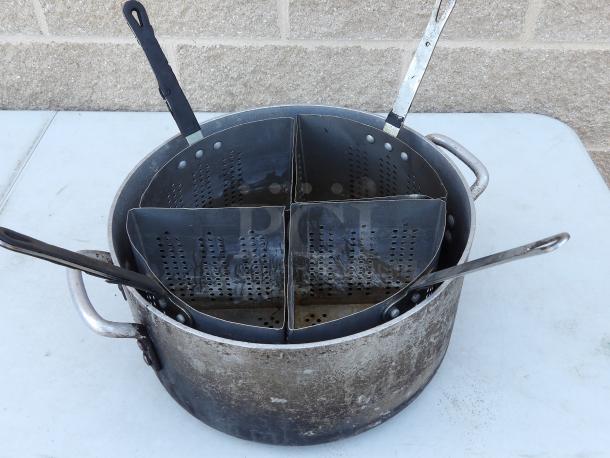 Aluminum pot with 4 removable strainers, 14" round x 7-1/2" deep, aged condition. Perforated strainers for easy draining.