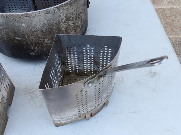 Aluminum pot with four removable strainers, 14" round, 7.5" deep, used condition, showing perforated metal design.