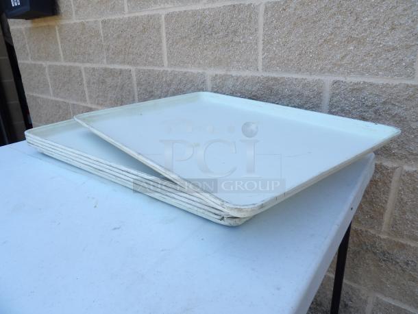 18" x 26" white fiberglass market display trays, showing slight wear, stacked on a table, auctioned as a set of 10.