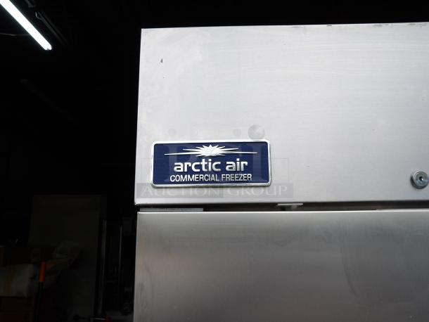 Like New Arctic Air AF23 stainless steel commercial freezer, single door, poly-coated racks, on casters with label shown.