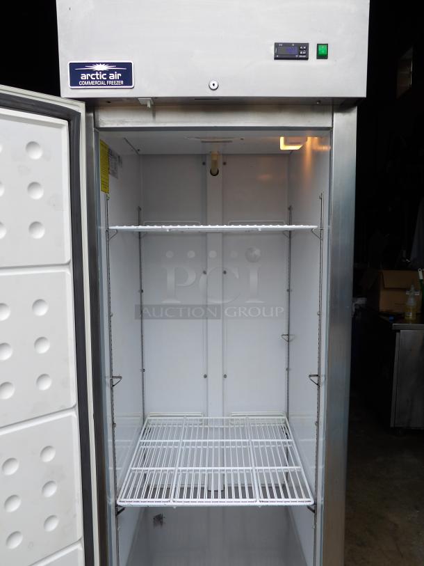 Arctic Air AF23 stainless steel single door freezer, like new, with poly-coated racks, digital display, on commercial casters.