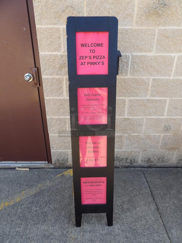 Wooden display sign easel with black frame featuring promotional menus for Zep's Pizza at Pinky's, red background text.