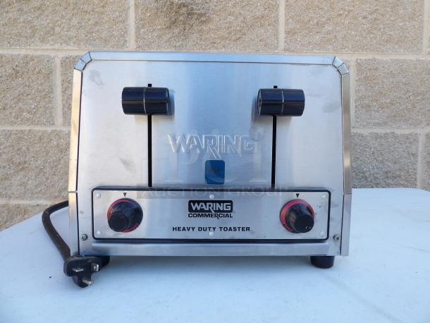 Waring WCT805B stainless steel commercial 4-slot toaster, 208V, 1-phase, heavy-duty, NSF certified; slight wear visible.