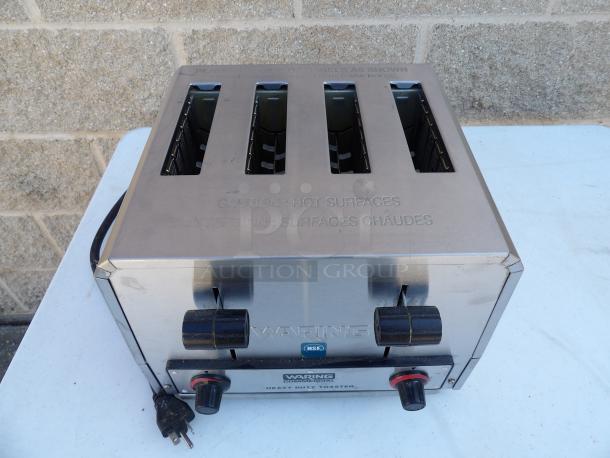Waring WCT805B stainless steel 4-slot commercial toaster. Features include dual controls and caution labeling. 208V, 1 phase.