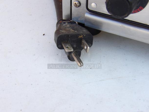Waring WCT805B stainless steel toaster plug and base close-up, showing minor wear. Model suited for 208V, 1 phase use.