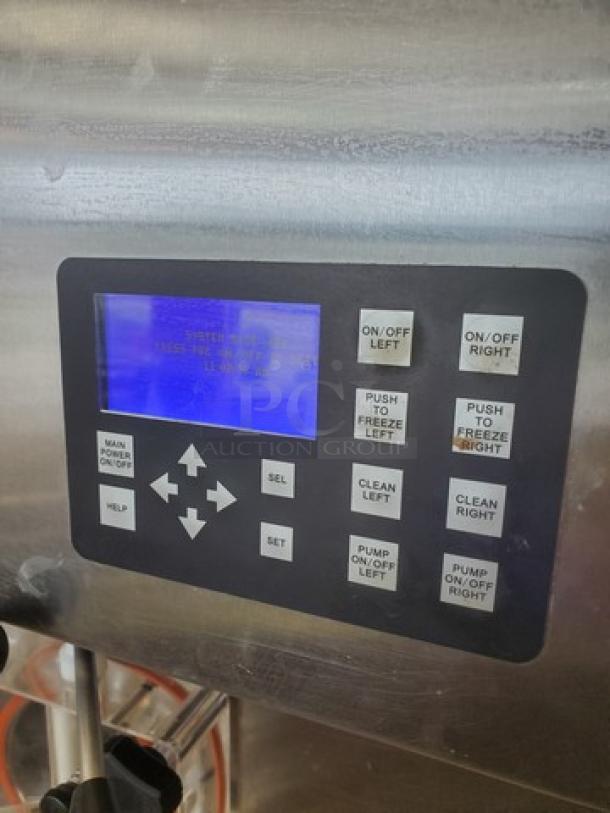 Control panel of Stoelting DQU431-409I2 soft serve freezer, showing digital screen and button controls.