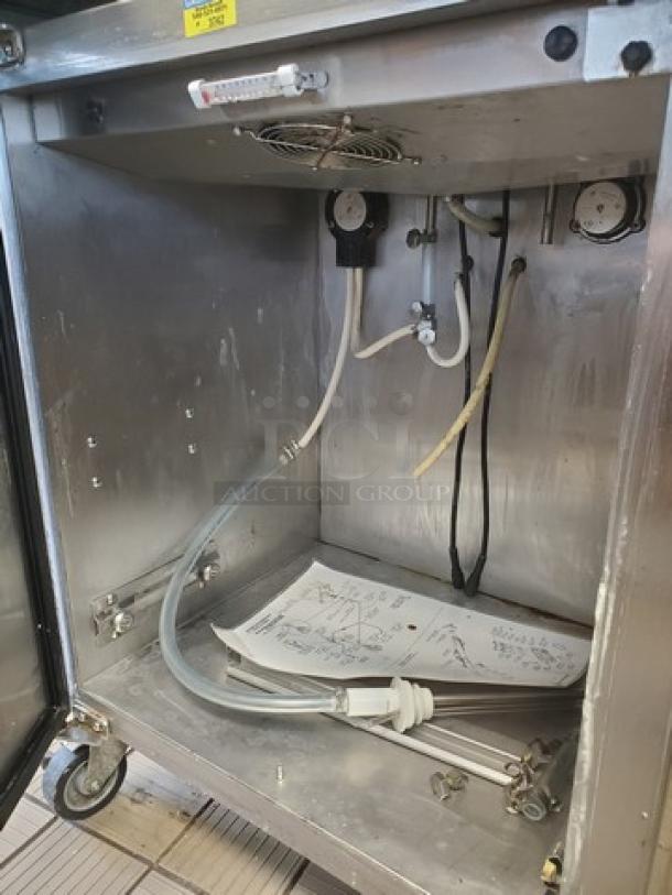 Stoelting DQU431-40912 soft serve freezer interior, showing hoses and manual. Features dual 8 gal hoppers, remote air cooling.