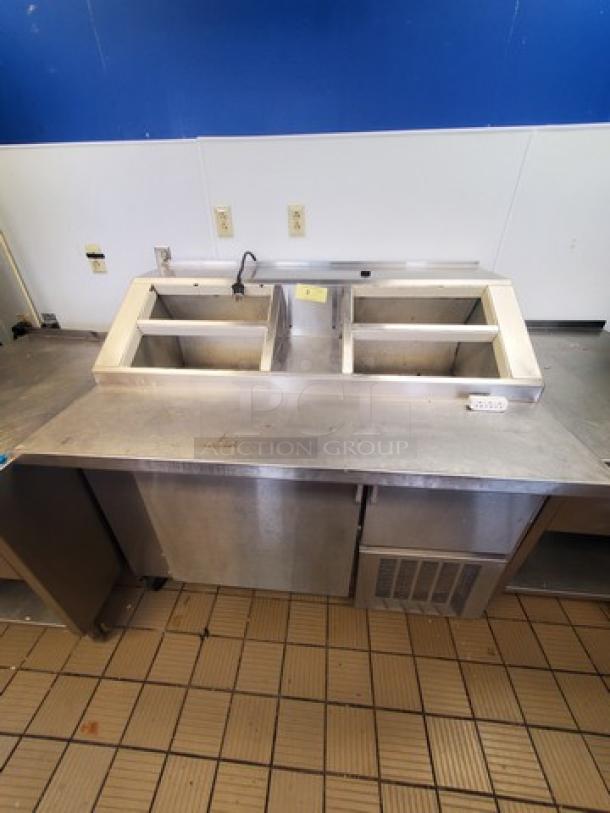 Nor-Lake ZF122SAS/0-2DQ 54" ice cream topping cabinet, stainless steel, dual compartments, good condition.