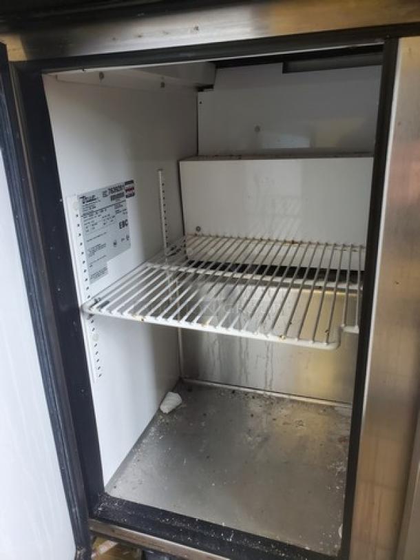 True Mega-Top Sandwich/Salad Unit, Model TSSU-36-12M-B, with solid door, interior shelving, minor wear visible.