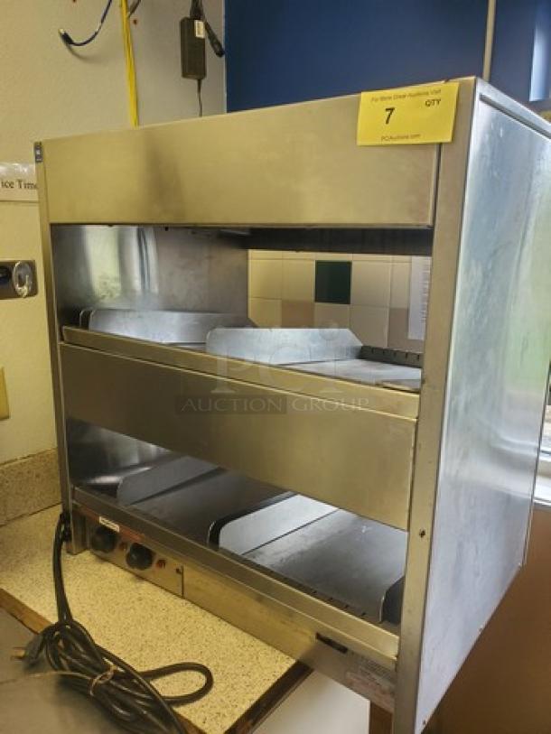 International Dairy Queen DD29 Double Level Food Warmer, stainless steel, visible wear, power cord included.