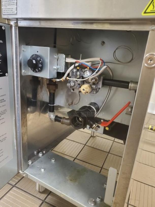 Cooking Performance Group FFOP50 natural gas fryer, 50 lb. capacity, stainless steel, 120,000 BTU, open pot design, internal view.