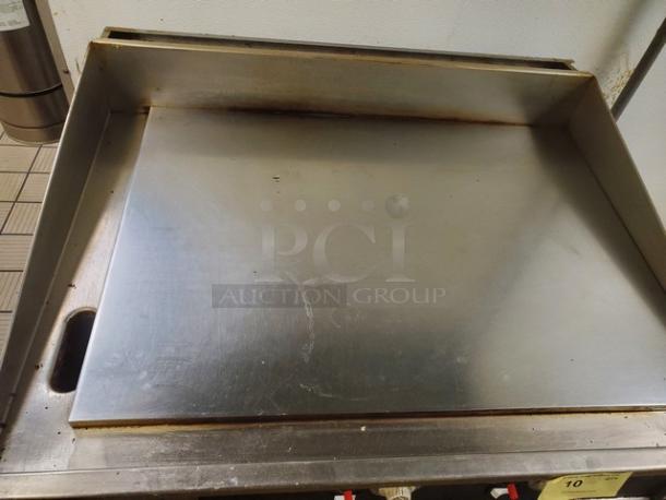 Miraclean natural gas griddle with stainless steel surface. Used condition with some surface marks.