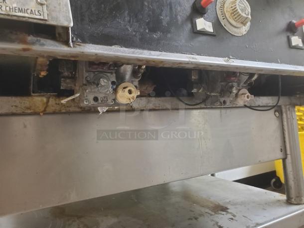 Miraclean natural gas griddle, showing controls and underside components. Used condition with visible wear and residue.