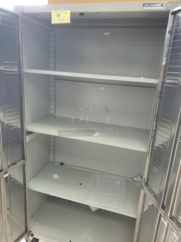Seville Classics UltraHD Storage Cabinet, metal, three shelves, open doors, model label visible, used condition.