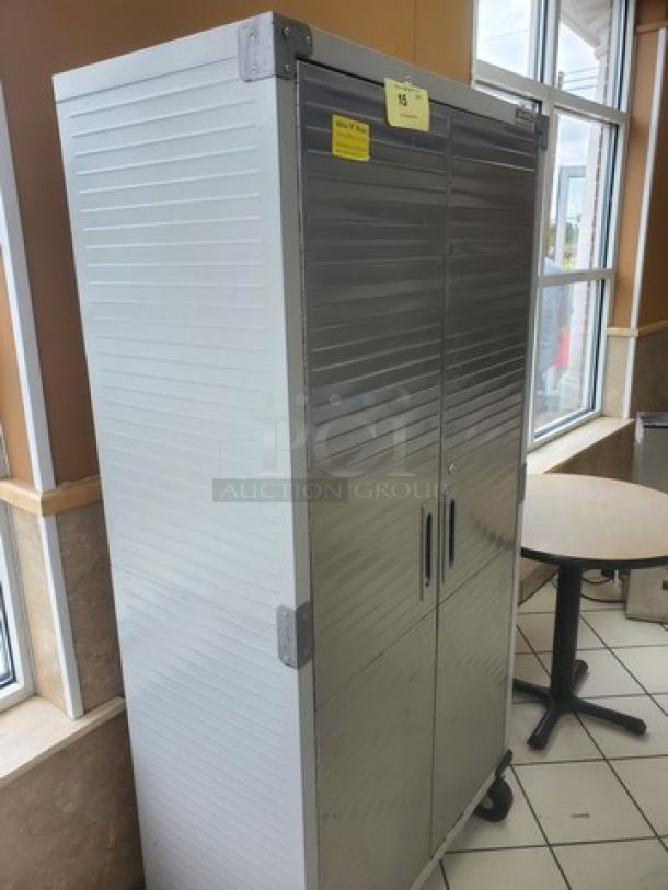 Seville Classics UltraHD Storage Cabinet, silver, dual doors, metal construction, wheeled base, visible locks, in good condition.