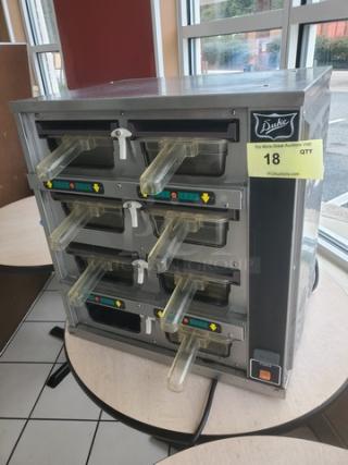 Duke FWM3-42-120 M pass-through heated food warmer cabinet, stainless steel, six compartments, used condition, Model FWM3-42-120 M.