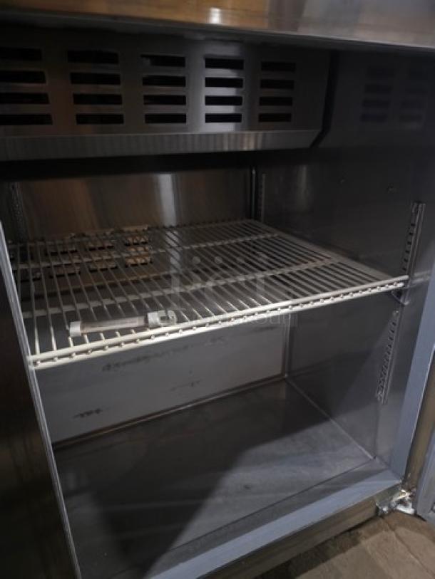 Avantco 47" 2-Door Refrigerated Sandwich Prep Table, Model 178APT48HC, stainless steel, includes shelving, good condition.